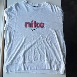 This is a white long sleeve tee from nike. It is in a size women’s large.